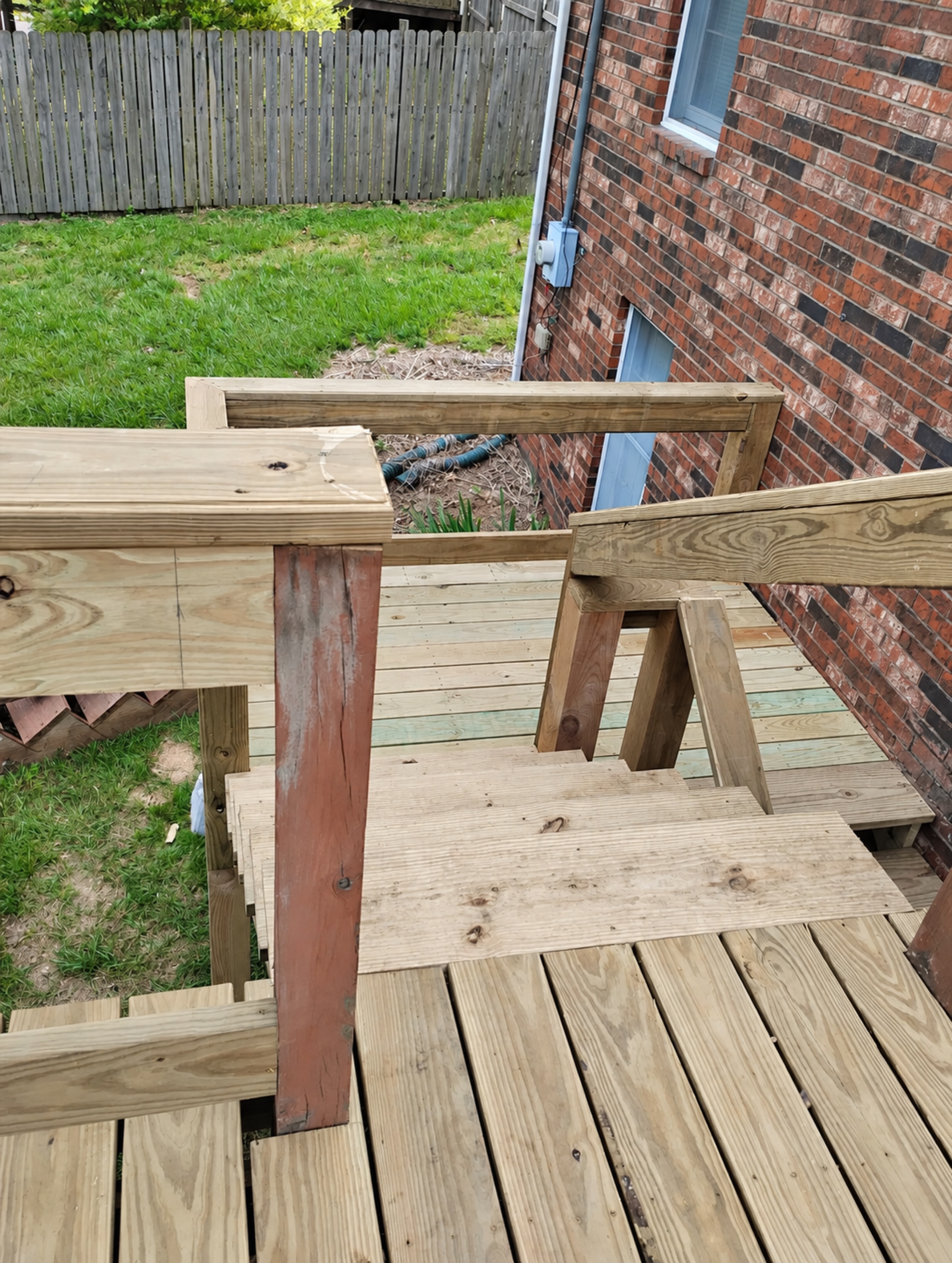 Exterior stair run and landing viewed from the upper deck during the rebuild