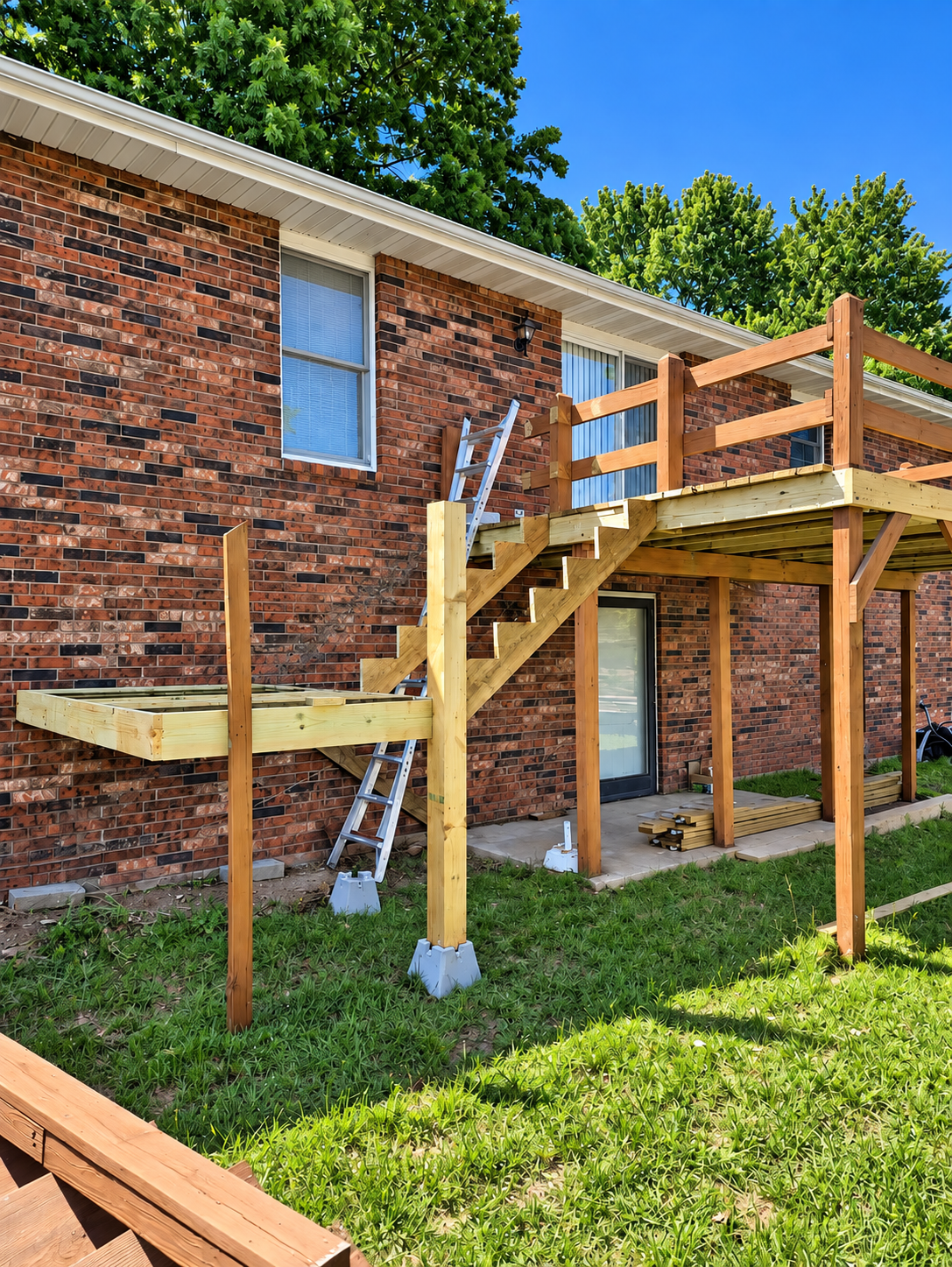 Pressure-treated stair and landing framing during deck reconstruction